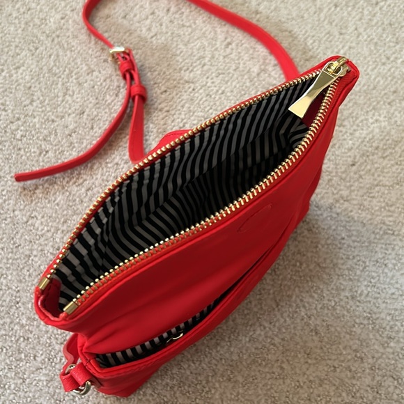 Kate Spade Red cross body purse. Fold over flap style. Zip pocket on front. - Picture 8 of 14